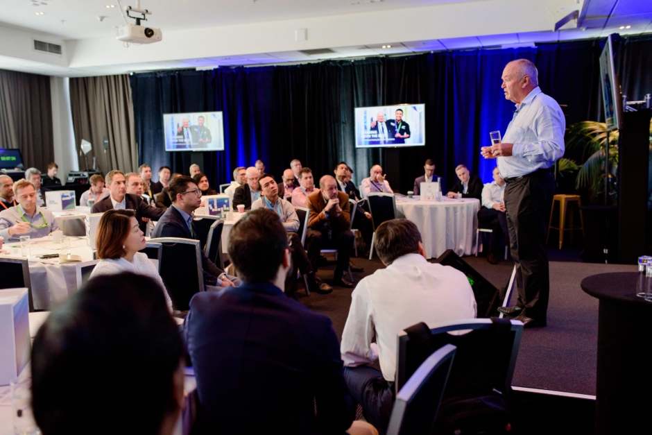 Graham Henry speaking at event at Rydges Auckland.